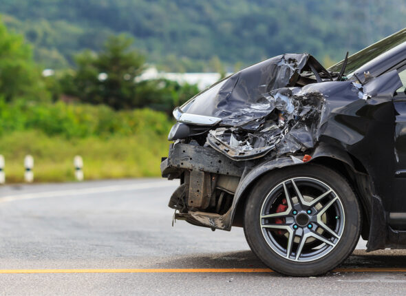 Black car get damaged by accident on the road
